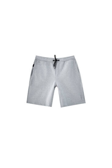 Technical fabric jogger Bermuda shorts - ecologically grown cotton (at least 50%)