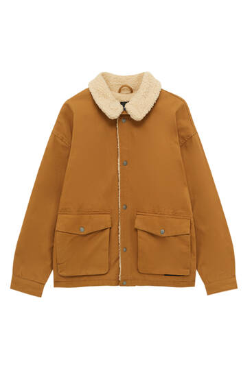 Utility jacket with faux shearling lining