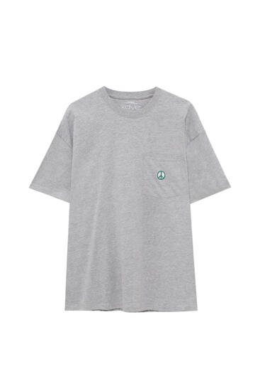 T-shirt with peace symbol on the pocket