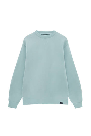 green and blue sweatshirt