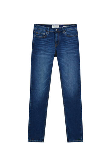 Ciemnoniebieskie jeansy super skinny z efektem sprania