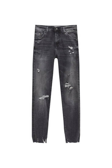 Jeans skinny fit strappati tessuto premium