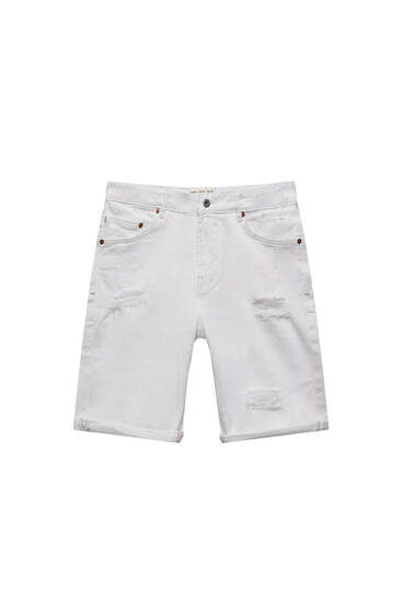 White slim-fit denim Bermuda shorts with ripped detail