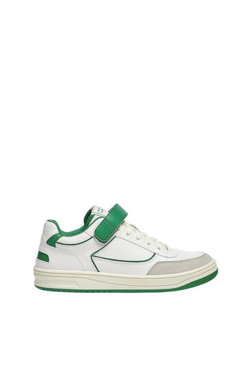 Casual trainers with adhesive strap