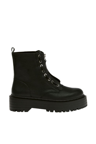 Black platform boots with zip detail