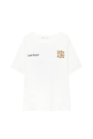 White T-shirt with Look Deeper graphic