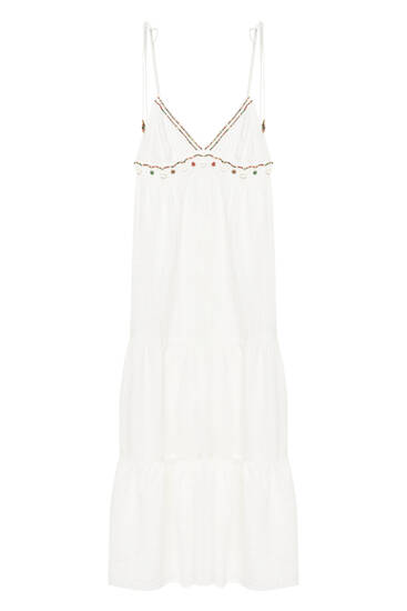 Lange witte jurk met schelpen