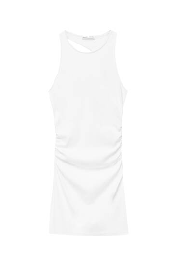 Vestito corto bianco con schiena asimmetrica