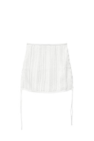 Mini skirt with side drawstrings