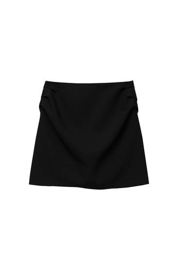 Minifalda pliegues