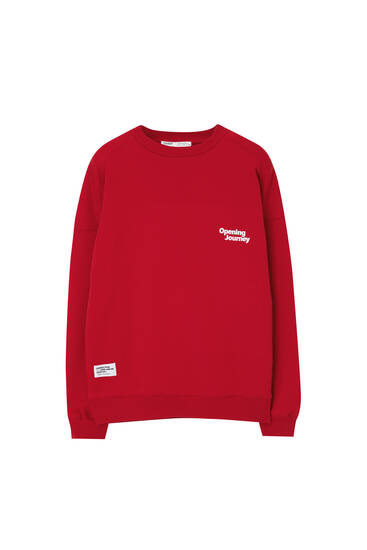 Red sweatshirt with front slogan