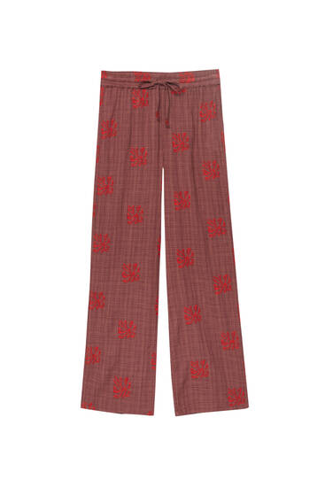 Flowing trousers with embroidery