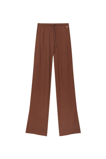 Rustic trousers with flowing silhouette