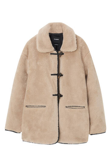 Faux fur coat with toggle fastening