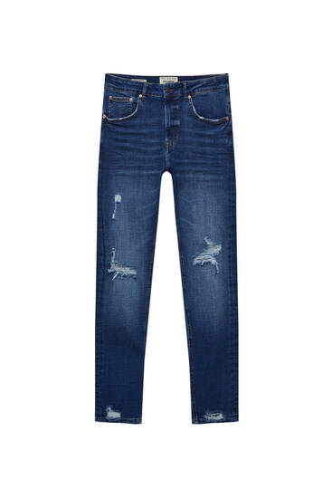 Jeans super skinny strappati