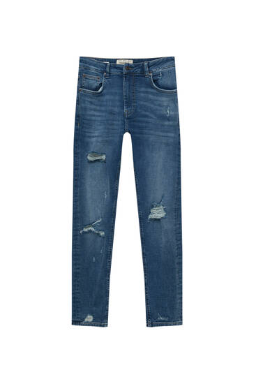 Jeans super skinny strappati