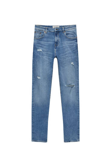 Jeans skinny strappi