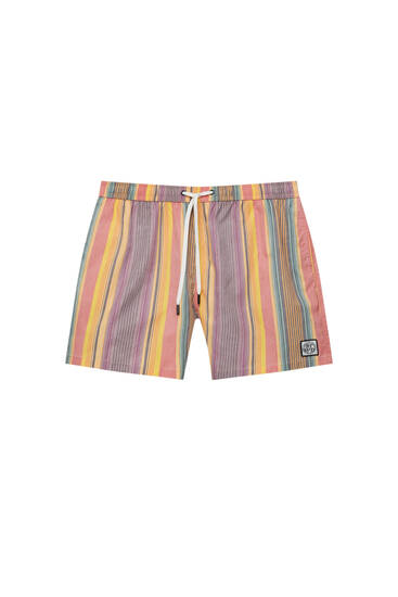 Striped swimming trunks with STWD label