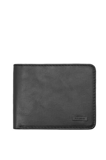 Black wallet with tag