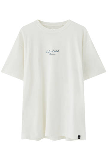 White T-shirt with graphic slogan on the front
