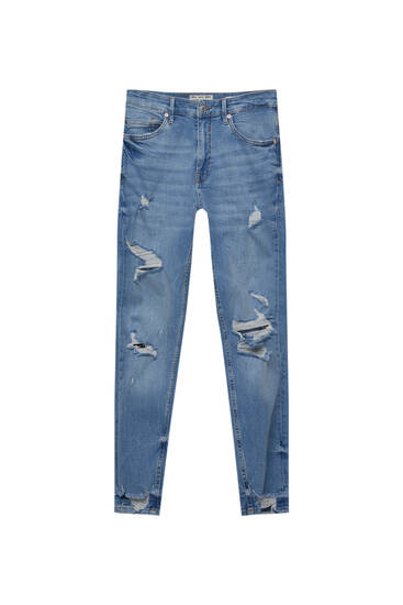 Jeans carrot fit con strappi