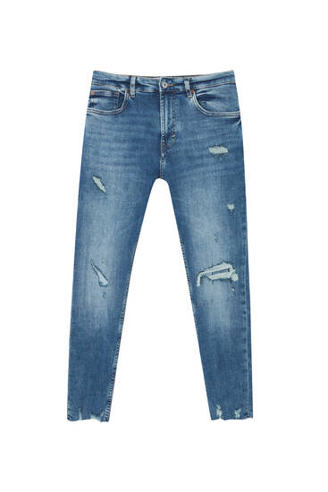 Jeans skinny strappi