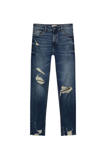 Jeans carrot fit con strappi