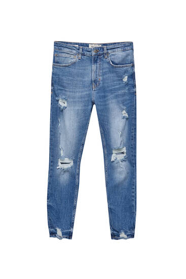 Jeans skinny tessuto premium con strappi