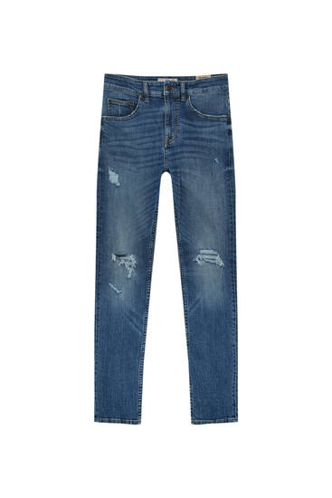 Jeans super skinny strappi