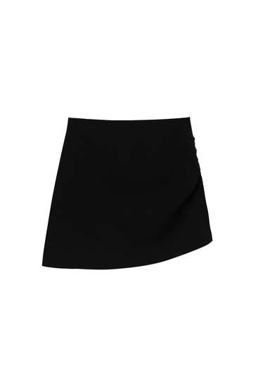 Black asymmetric mini skirt