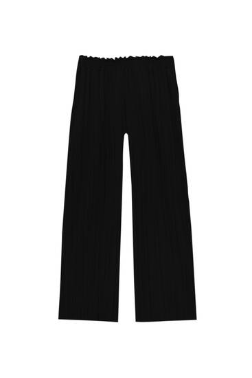Flowing trousers with box pleats