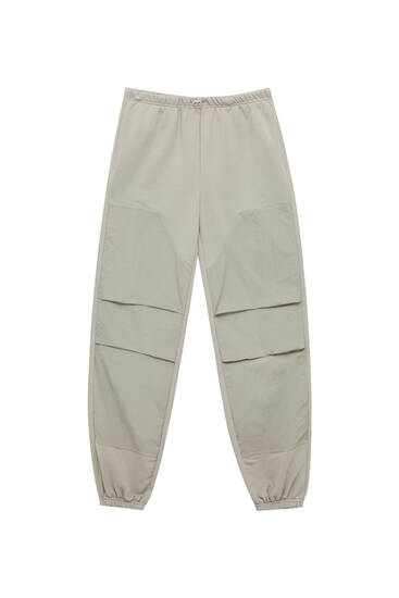 Parachute trousers with contrast fabric