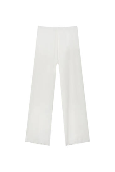 Semi-sheer white trousers