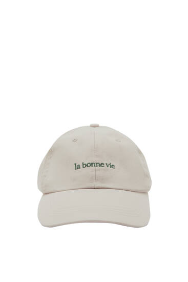 Faded cap with ‘La bonne vie’ embroidery