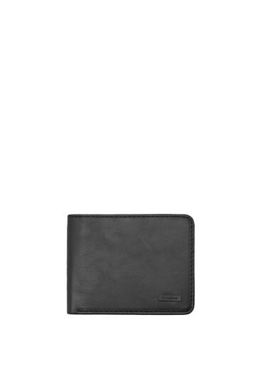 Black wallet with tag