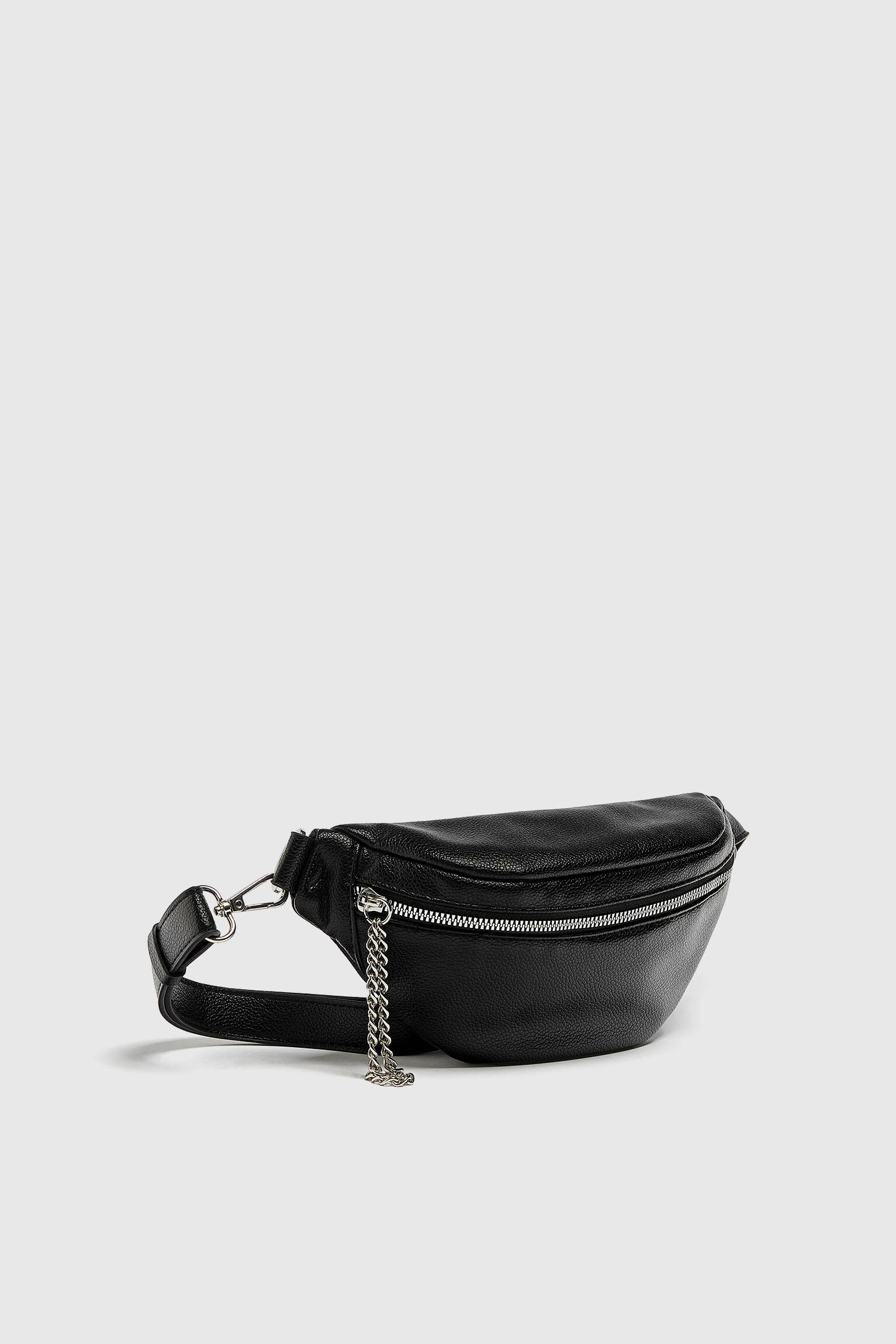 Pull & Bear Fanny pack with chain detail. a black fanny pack with a silver chain hanging from it. 