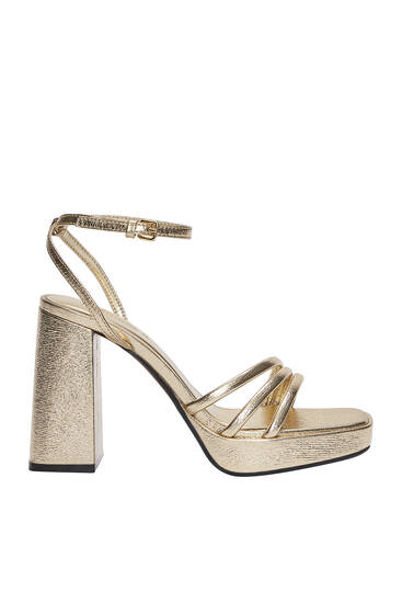 Gold sandals with ankle strap