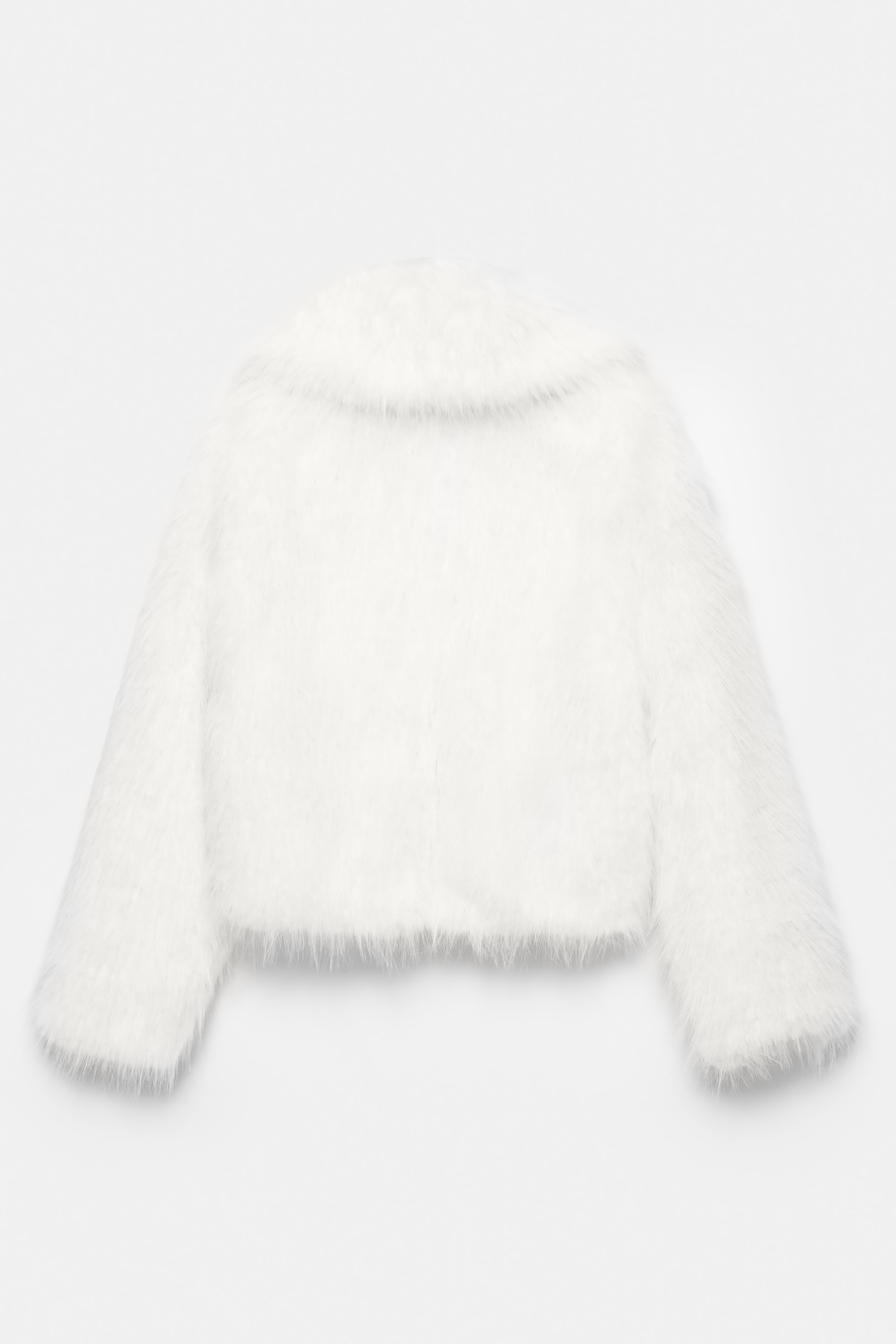 Veste en fausse fourrure blanche
