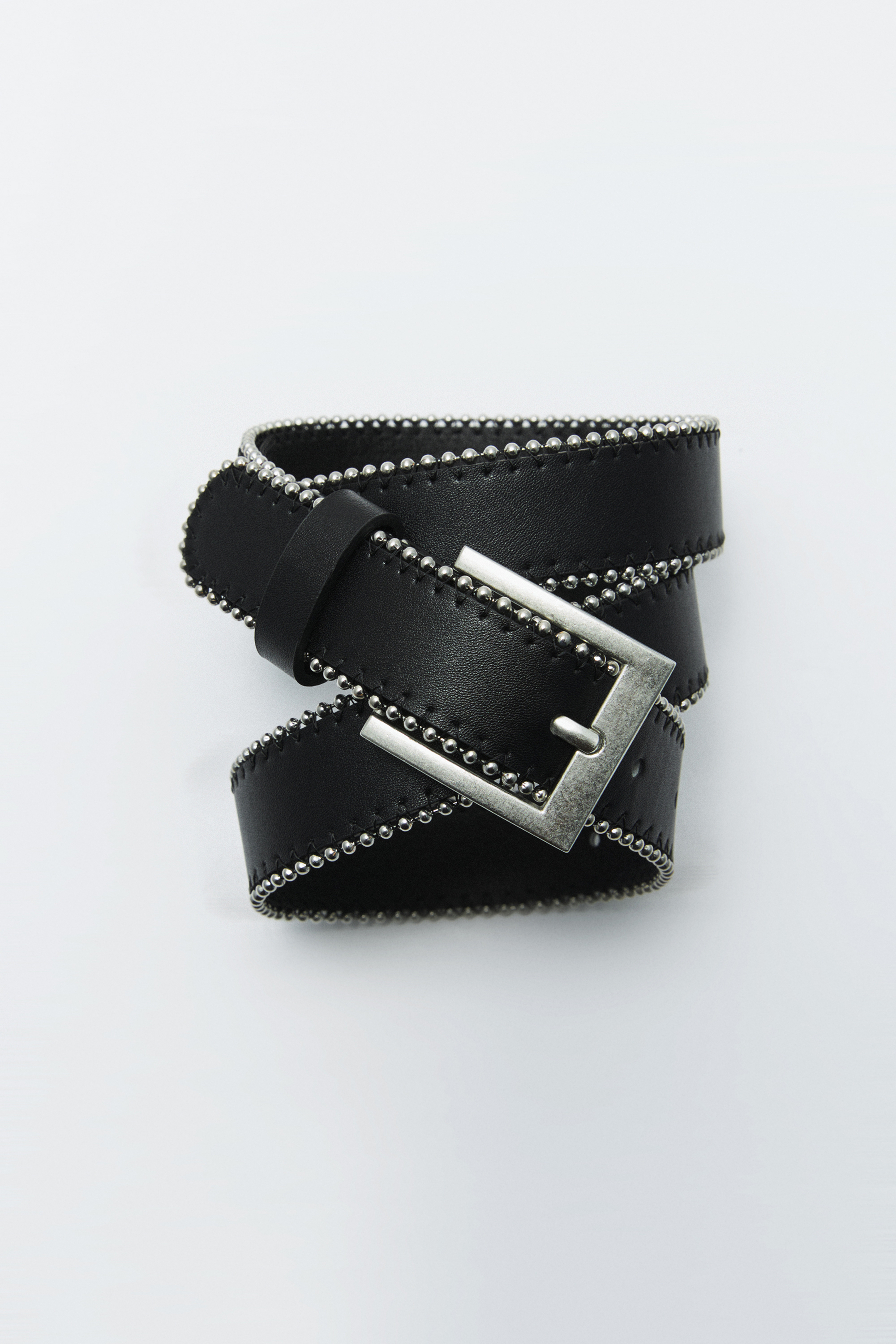 Faux leather belt with metallic edges