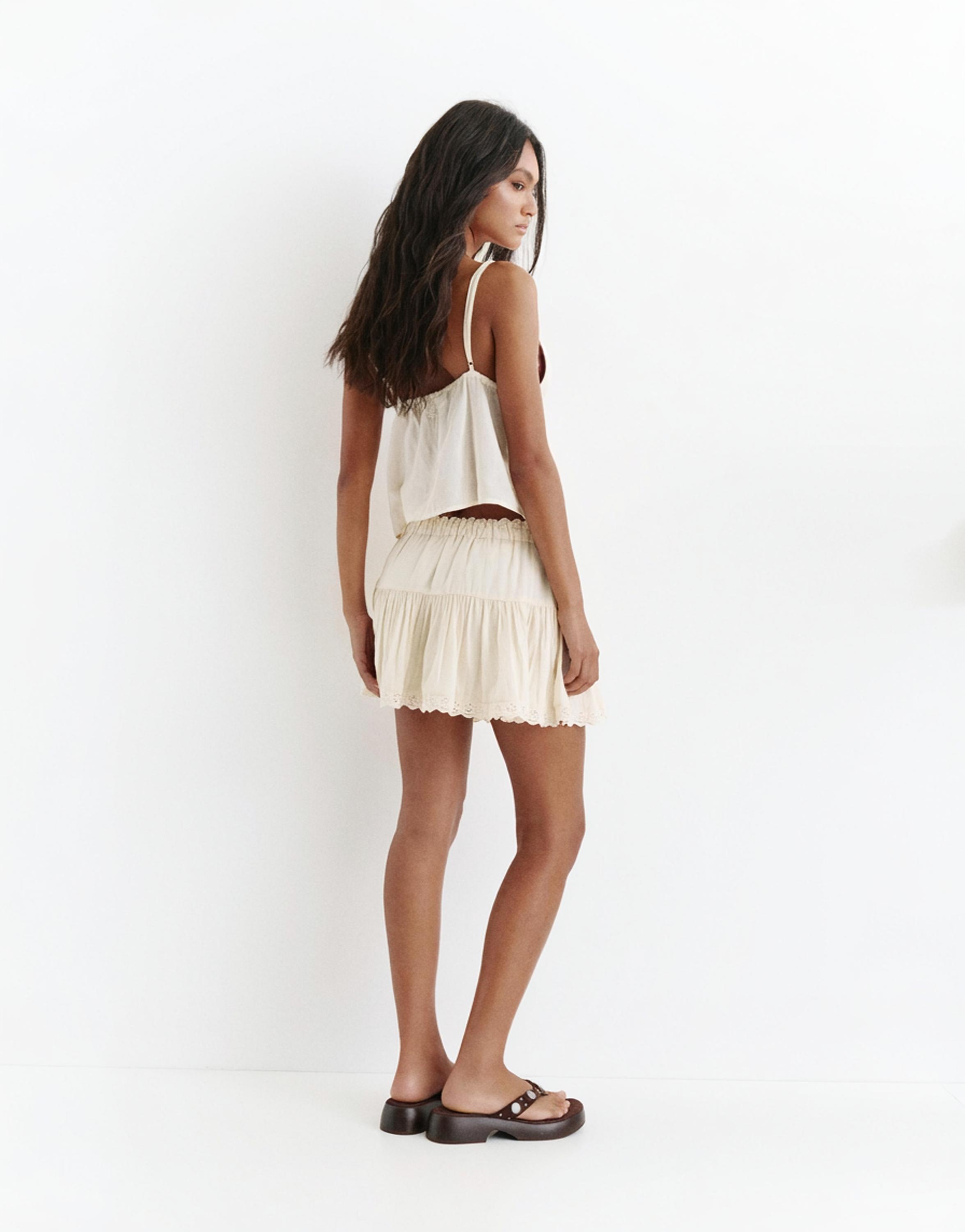 Ruffled mini skirt with lace trim — Beige