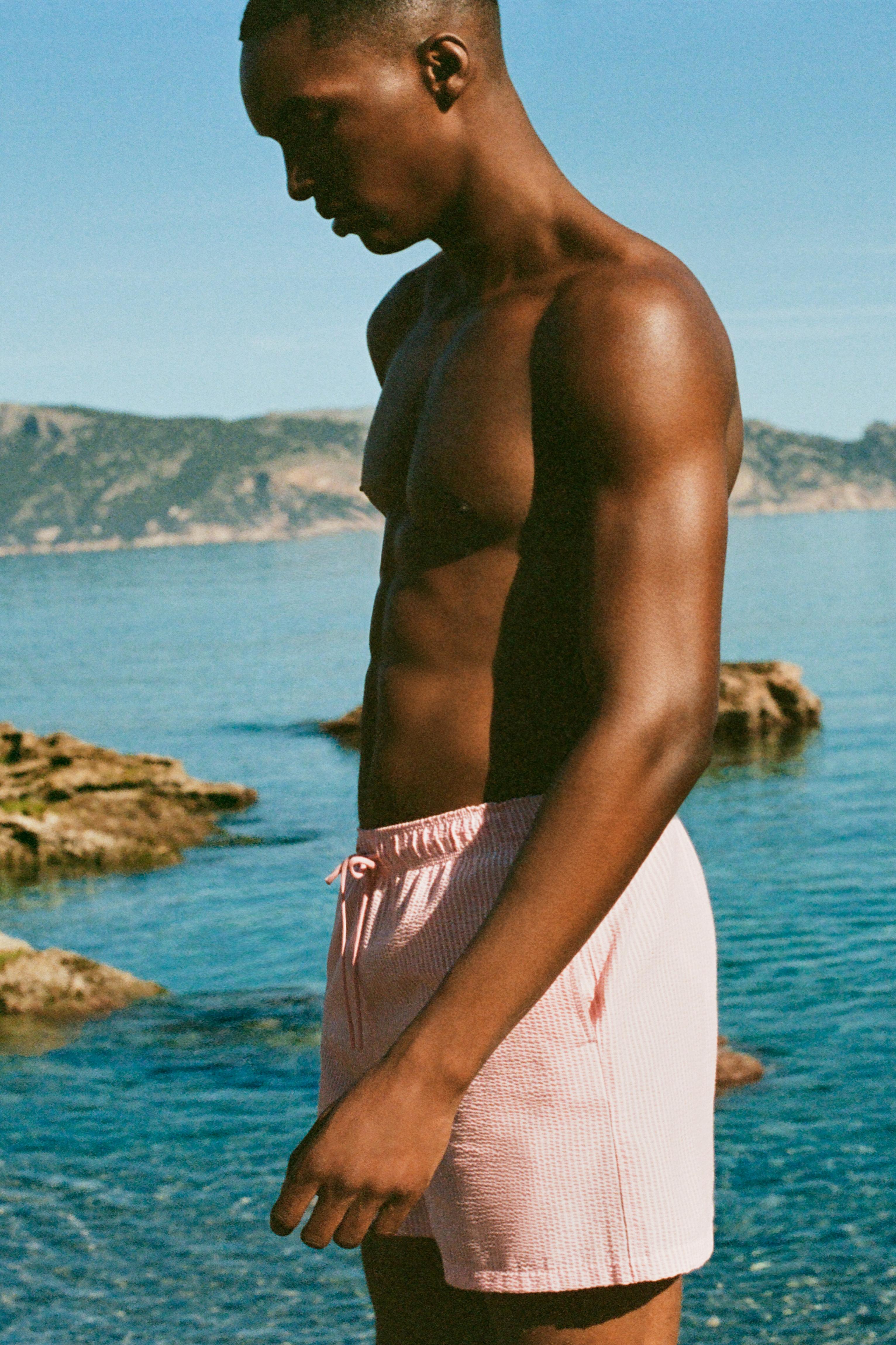 Striped seersucker swimming trunks — Pink