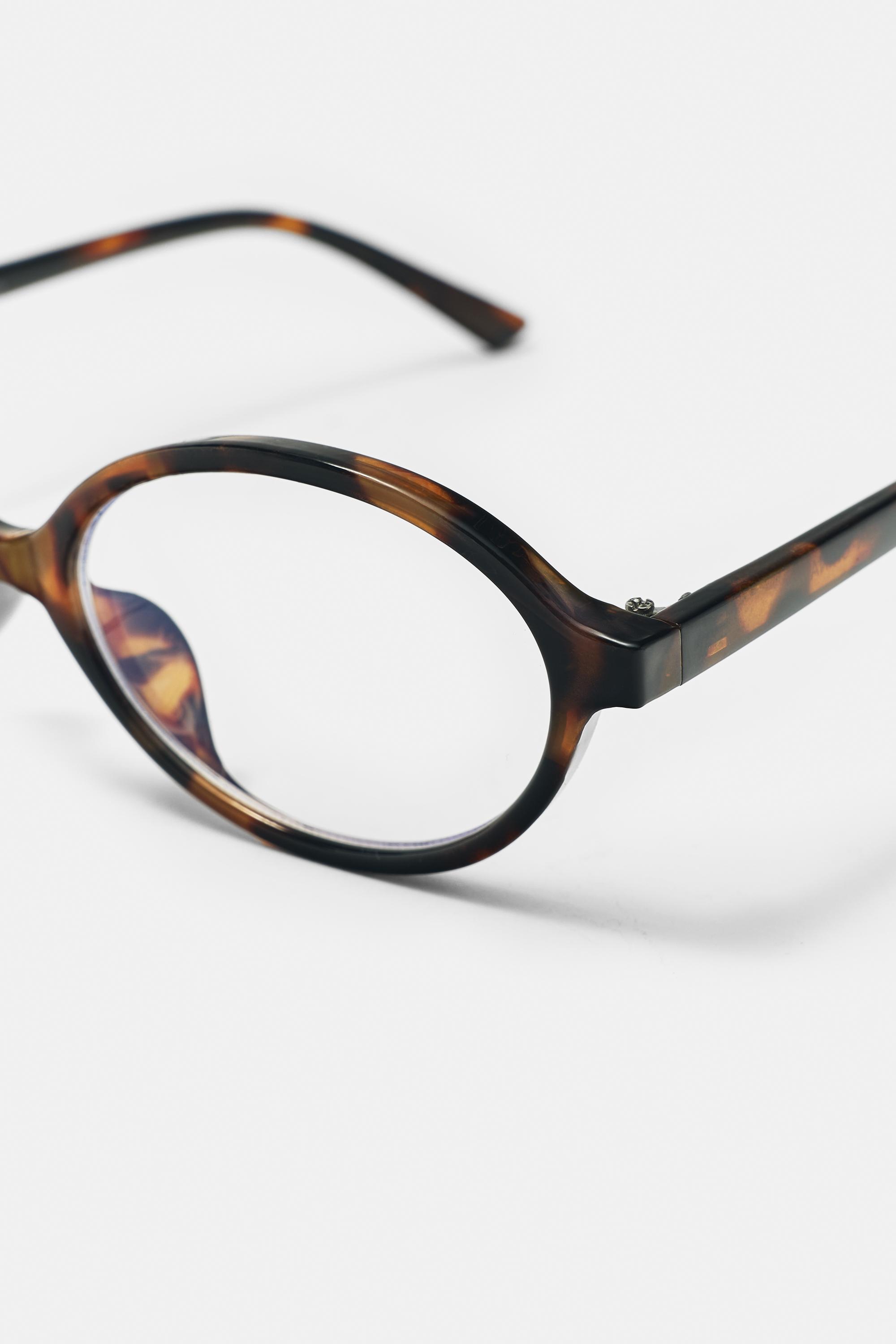 Oval tortoiseshell-effect sunglasses — Brown