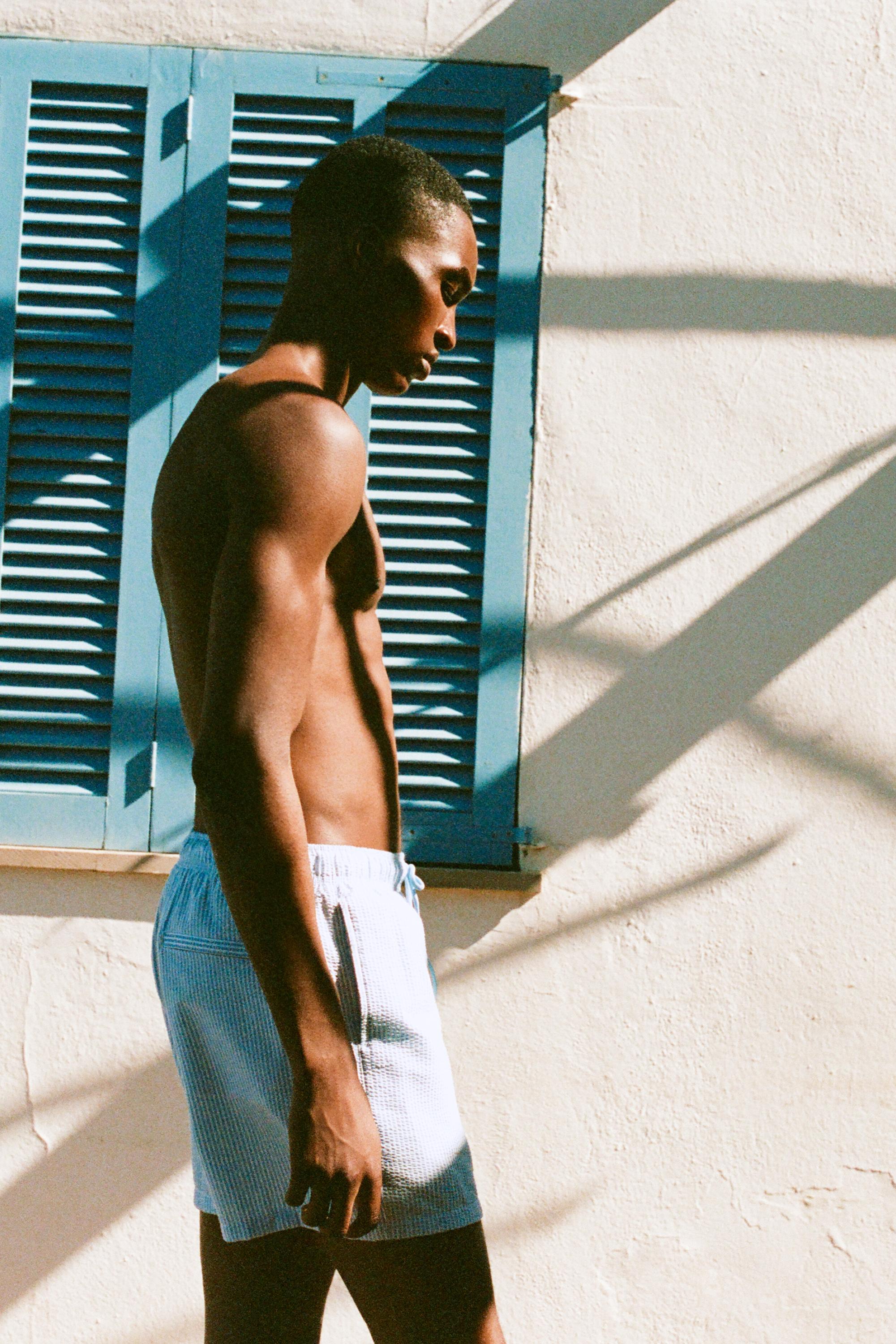 Striped seersucker swimming trunks — Blue