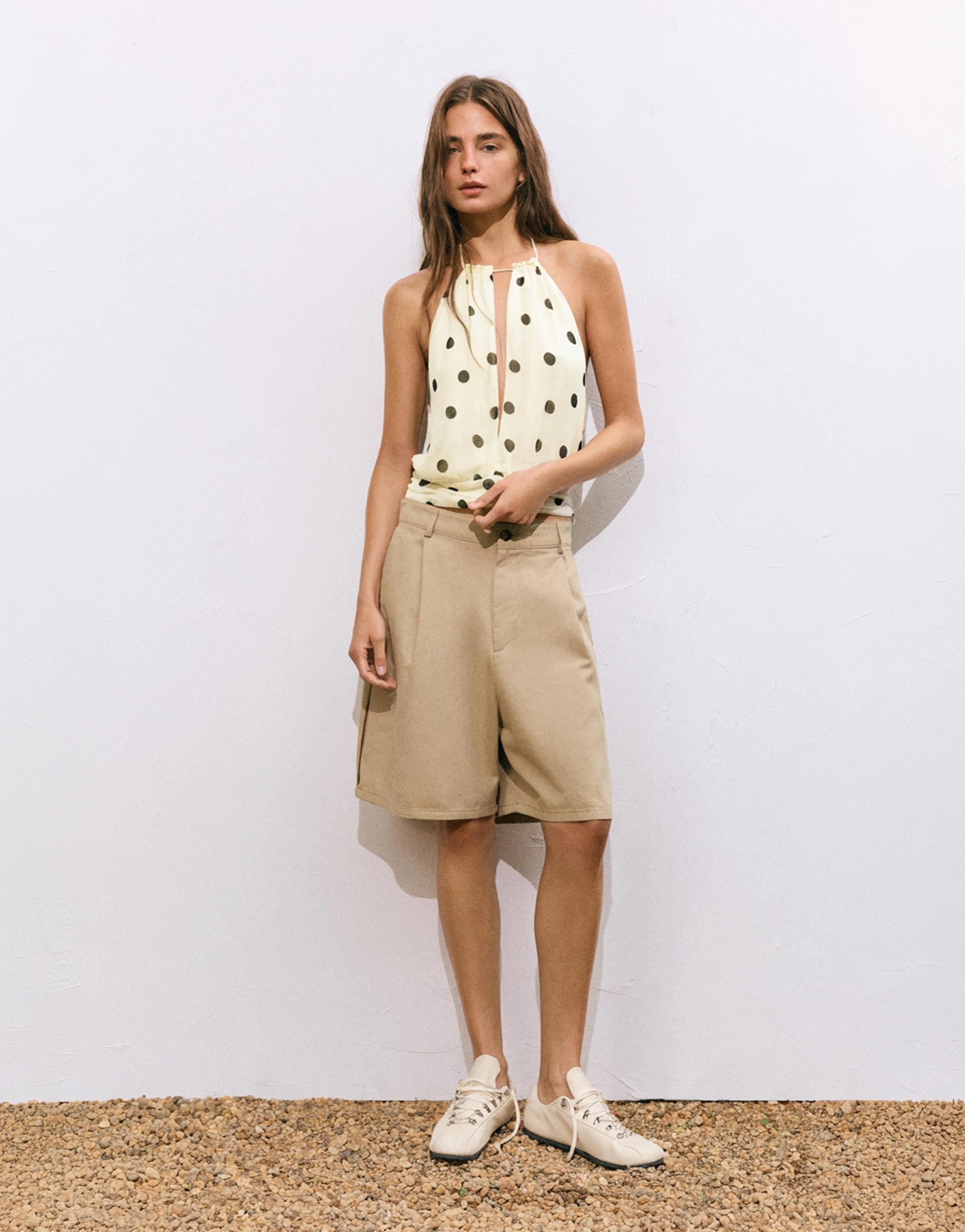 Polka dot halter top with cutout — White