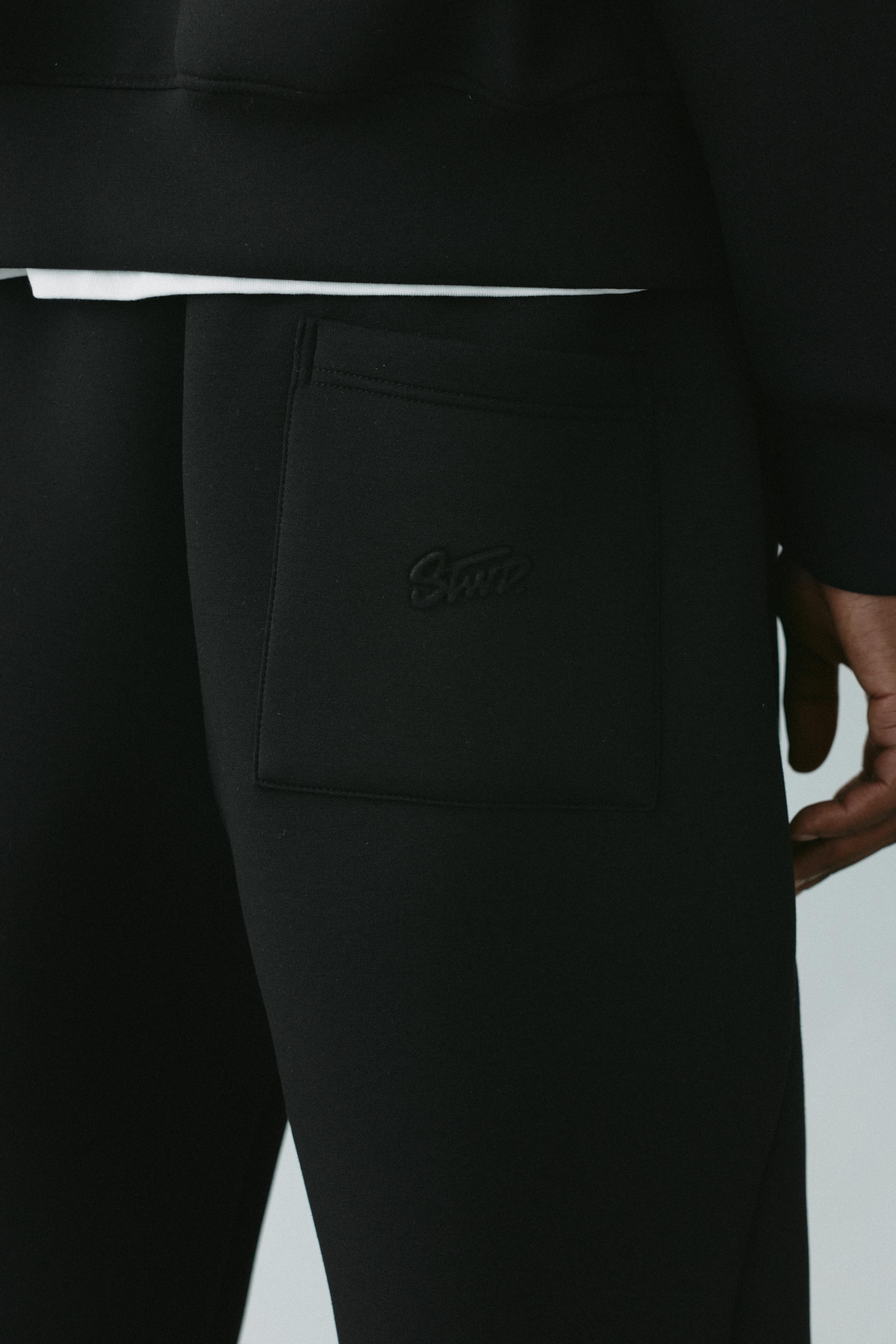 Neoprene-effect baggy trousers — Black