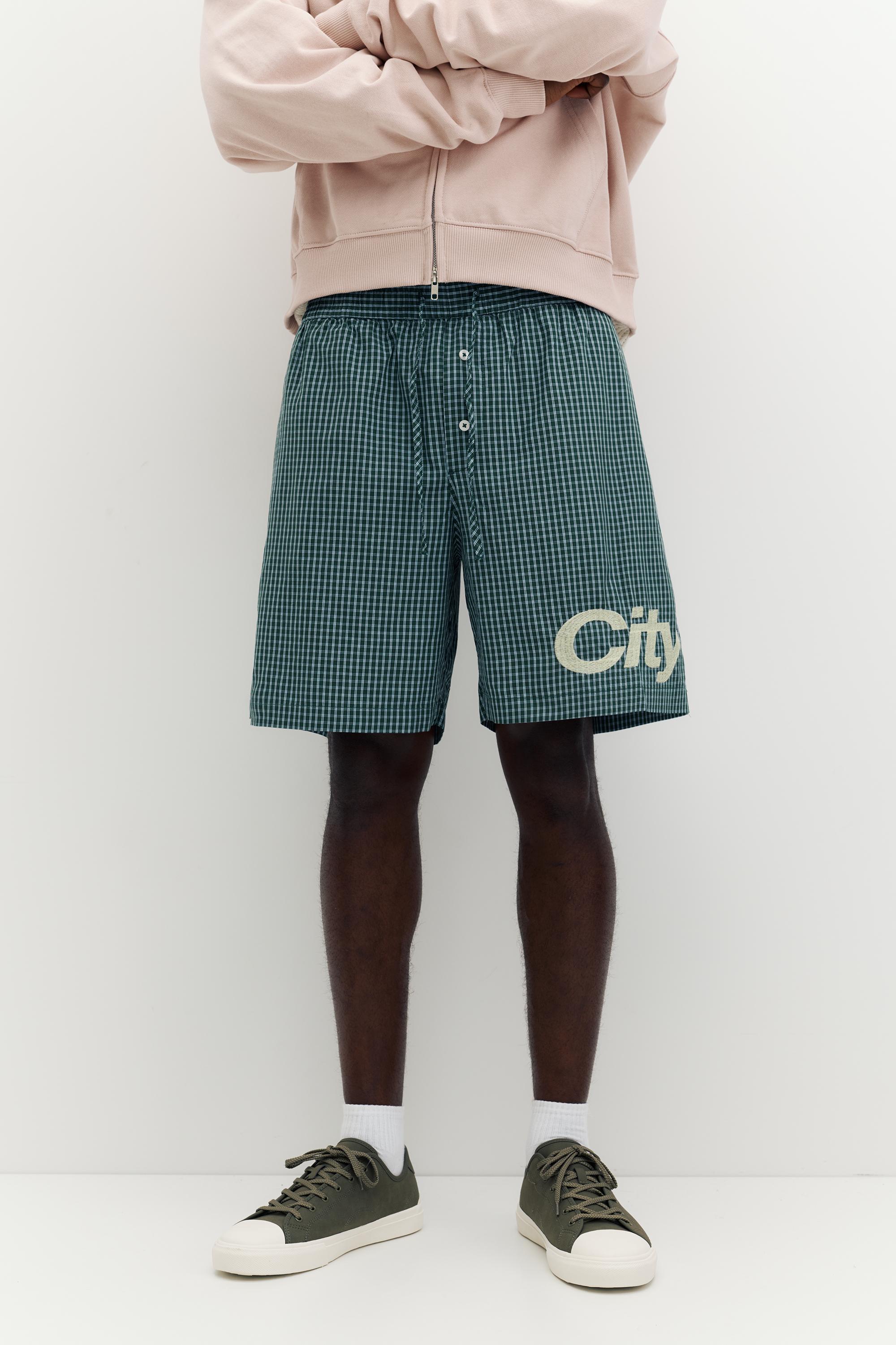 Checked graphic Bermuda shorts — Moss