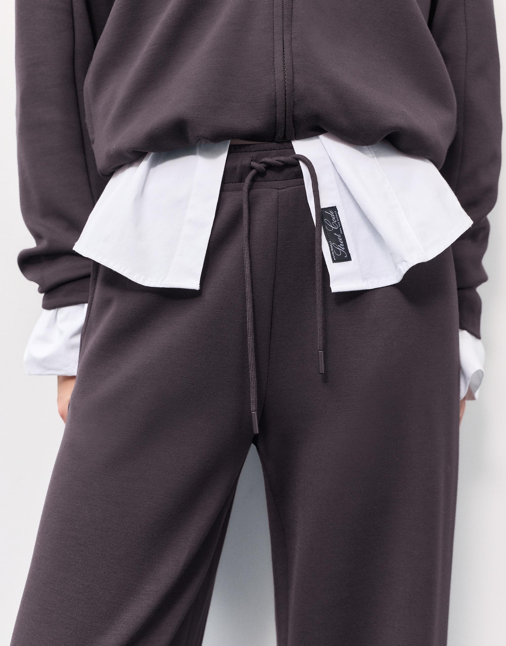 Soft-touch wide-leg trousers — Black