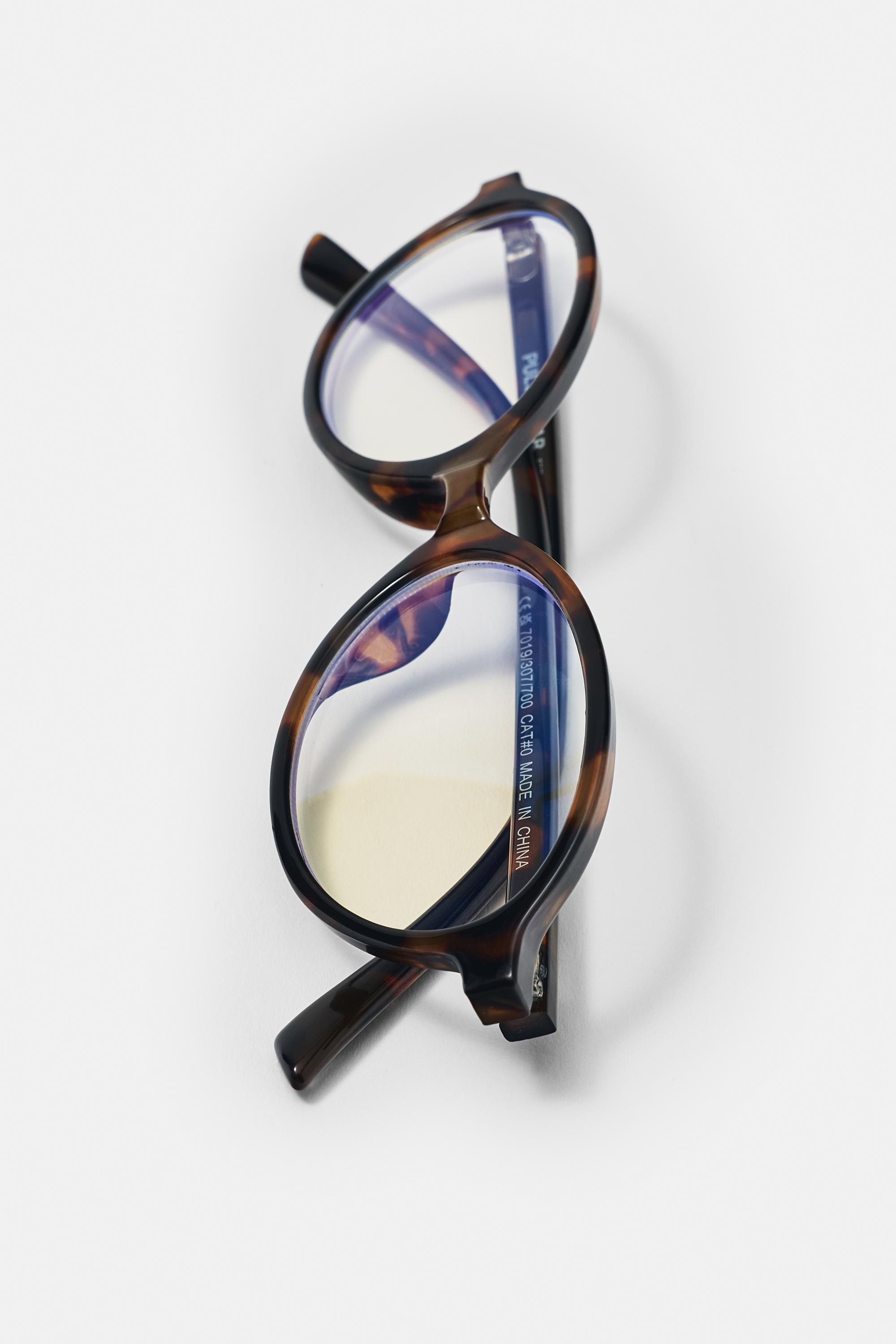 Oval tortoiseshell-effect sunglasses — Brown
