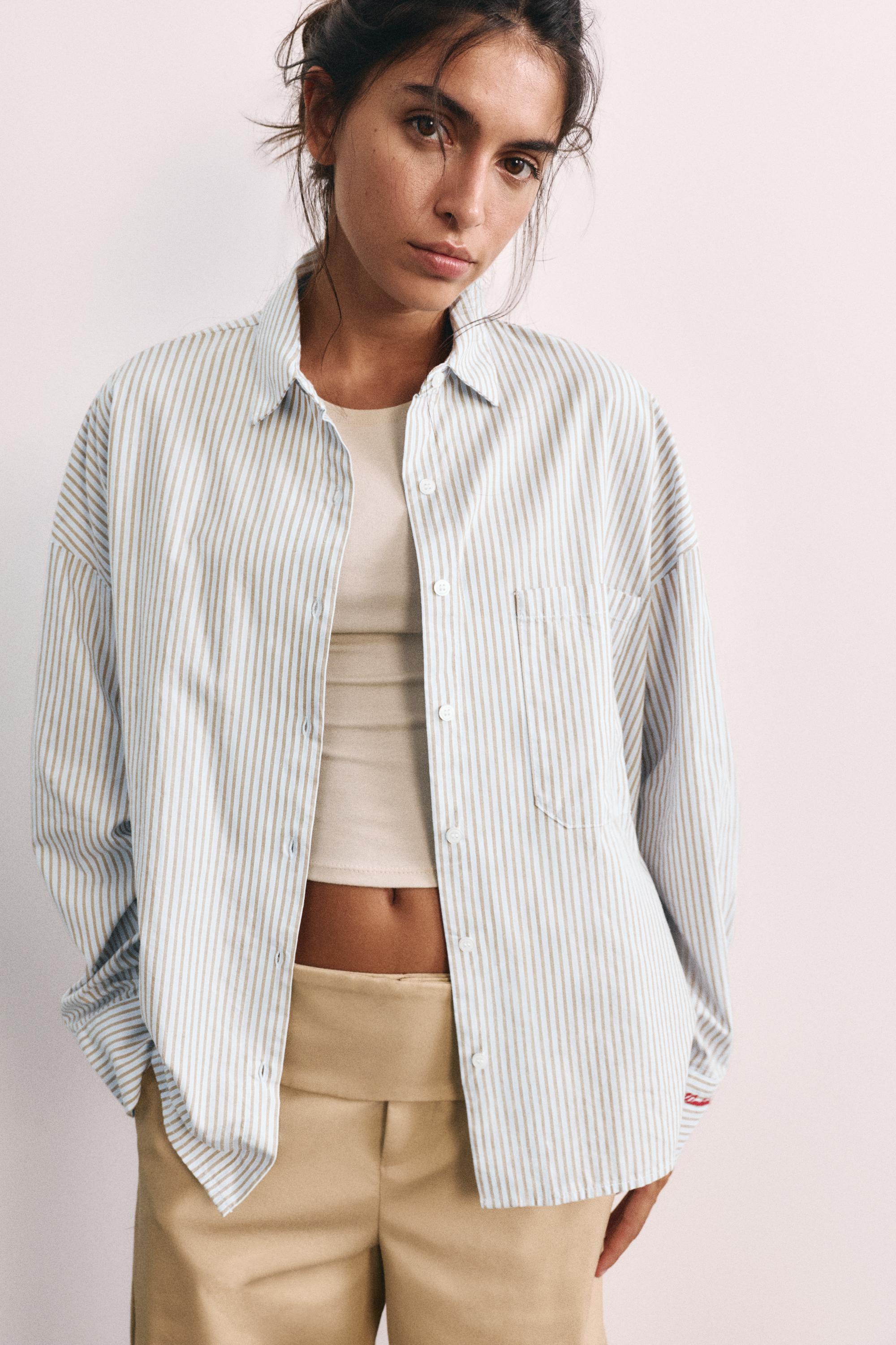 Embroidered striped shirt — Pastel blue