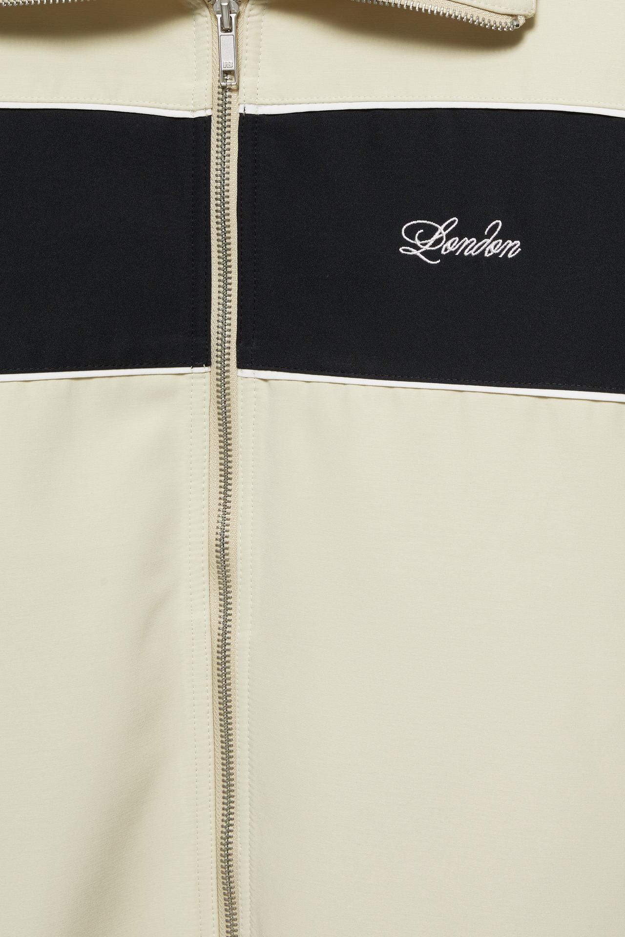 Zip-up panelled jacket — Ecru/Black